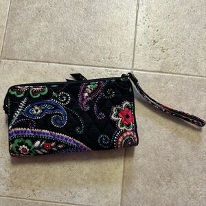 Vera Bradley wallet 8x4.5” also a wristlet. Great pockets inside and outside